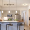 kitchen with barstools and pendant lighting