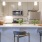 pendant lights over open kitchen counter with stools