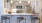 pendant lights over open kitchen counter with stools